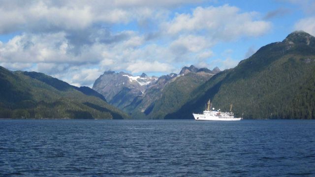 NOAA Ship FAIRWEATHER and the majestic peaks of Chatham Strait area. Picture