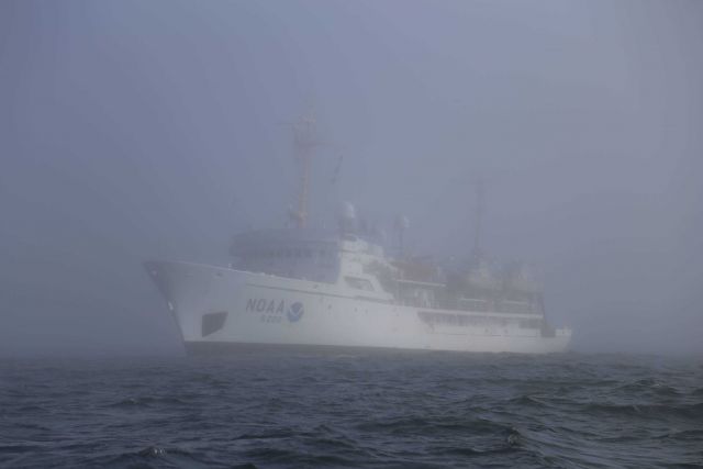 NOAA Ship FAIRWEATHER servicing weather buoy 46041 off the Washington coast between Aberdeen and Cape Flattery on a foggy summer day. Picture