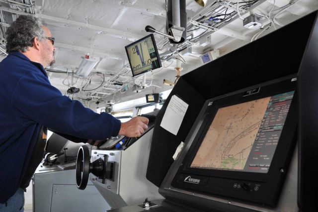 Monitoring NOAA Ship FAIRWEATHER's position on an electronic chart off Cape Prince of Wales, the westernmost point of North America. Picture