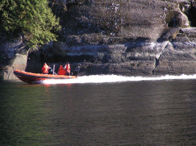 Rigid-hull inflatable boat proceeding to work area. Picture