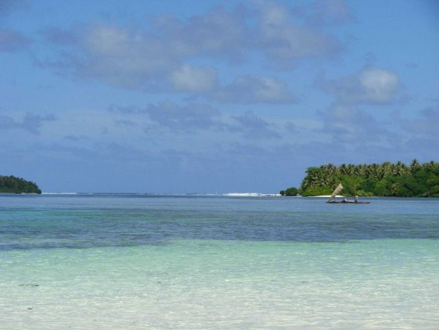 A native sailing canoe seen from the beach Picture