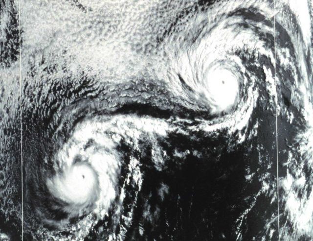 NOAA-3 visible range VHRR image of Hurricanes Ione (left) and Kirsten (right.) The rare effect of two interacting hurricanes is termed the Fujiwhara e Picture