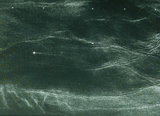 Ship tracks? Aircraft tracks? as seen from satellite? Note there are two objects in the image - middle left apparently traveling to W (left) Picture