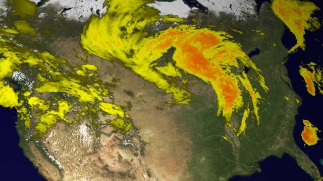 This image from the GOES-East full hemisphere infrared scan shows an extremely large and intense storm system that has rolled across the plains and in Picture