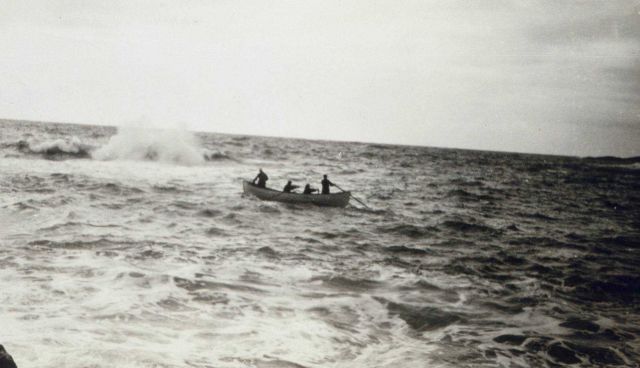 Sounding within surf line with rowed skiff Picture