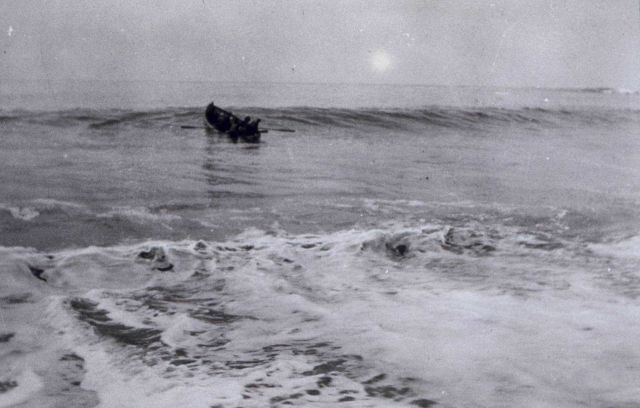 Landing through surf under oars. Picture