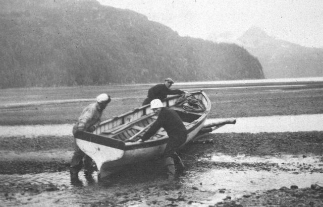 Taking boat for a walk over the mudflats Picture