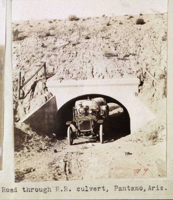 Squeezing through a railroad culvert Picture