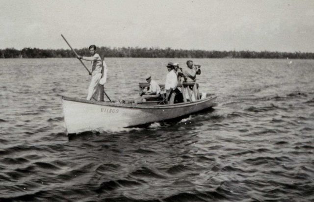 Using sounding pole to measure depth in shallow water Picture
