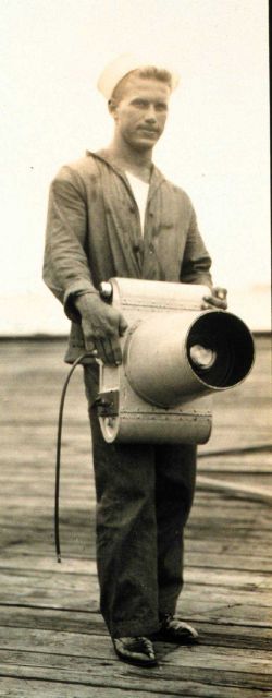 Navy crewman holding K-1 camera Picture