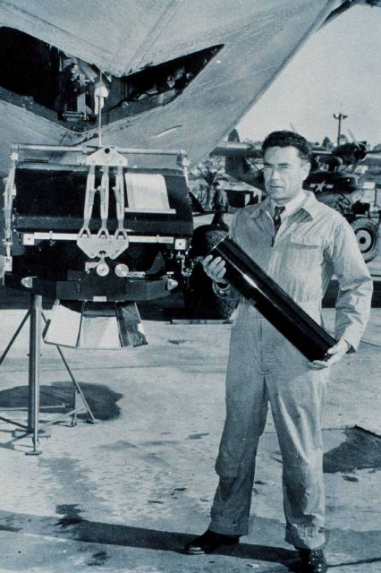 Photographer Byron Hale with a roll of nine lens camera film. Picture