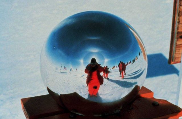 Photographer takes self-portrait in South Pole marker Picture