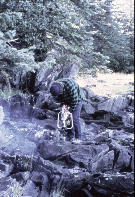 Using gas drill to drill hole for bench mark Picture