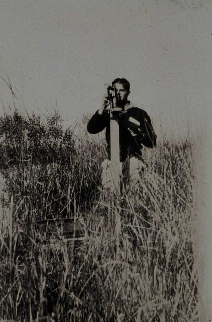Robert Earle running traverse survey in Cooper River area Picture