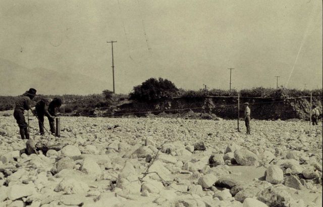 Measuring Pasadena Base across wash at foot of San Antonio Canyon Picture