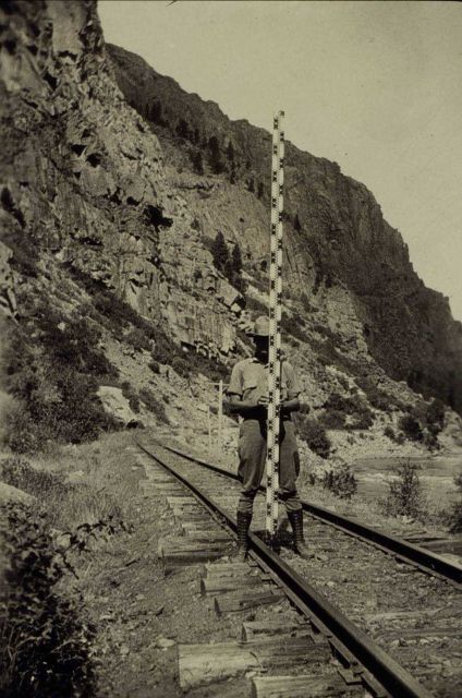 Rodman Fisk holding the level rod steady Picture