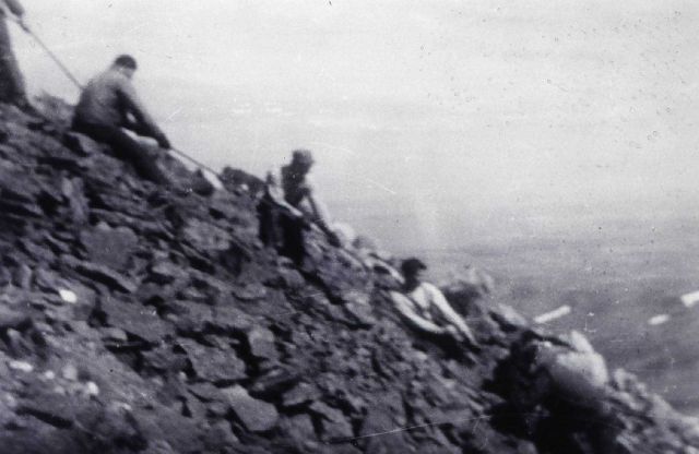 Hauling Shoran gear up Cape Mountain. Picture