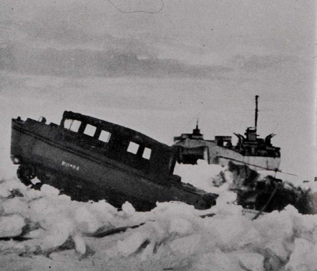 Snow-cat offloading gear from landing ship. Picture