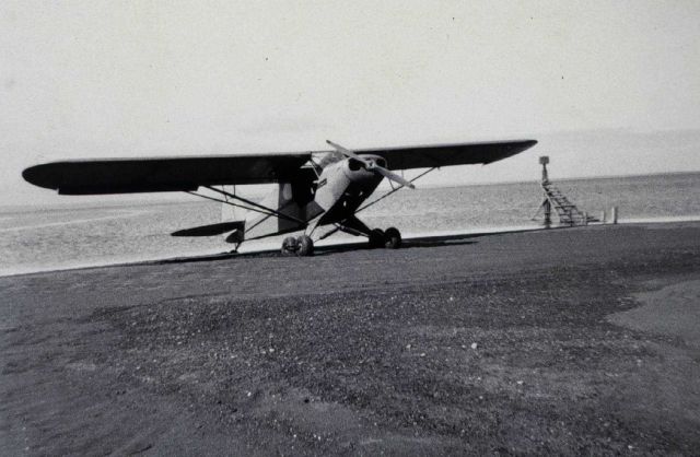 Tending a tide gage by plane Picture