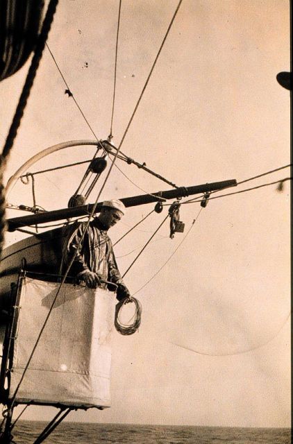 Trolley rig - paying out leadline by hand as trolley carriage runs down cable Picture