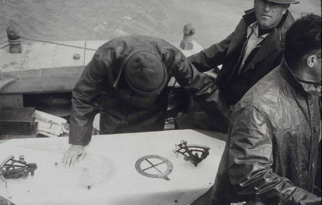 Checking boatsheet during wiredrag survey of Mitchell Jordan Reservoir Picture