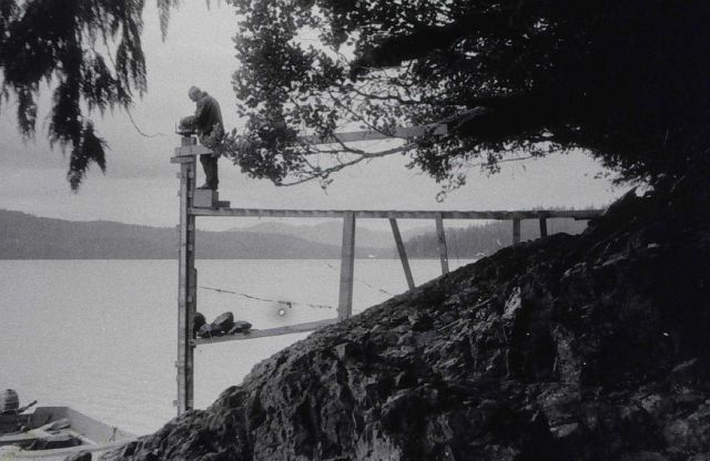 Tending tide gauge at east end of Soda Bay Picture