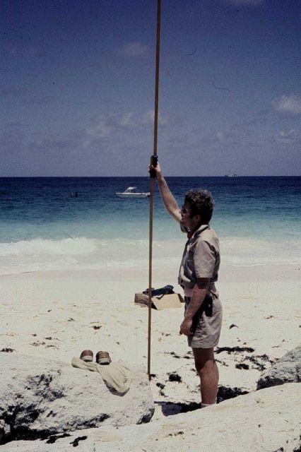 Lieutenant Dale Ross holding rod during tidal leveling operations Picture