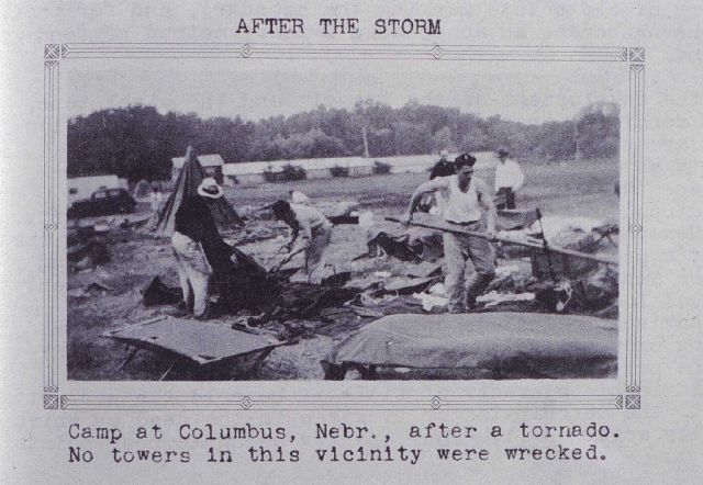Cleaning up after a tornado hit the camp in Columbus Picture