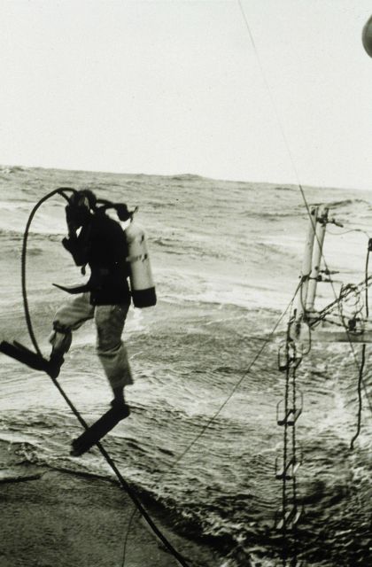 Lieutenant Larsen heading over the side to check if propeller fouled Picture