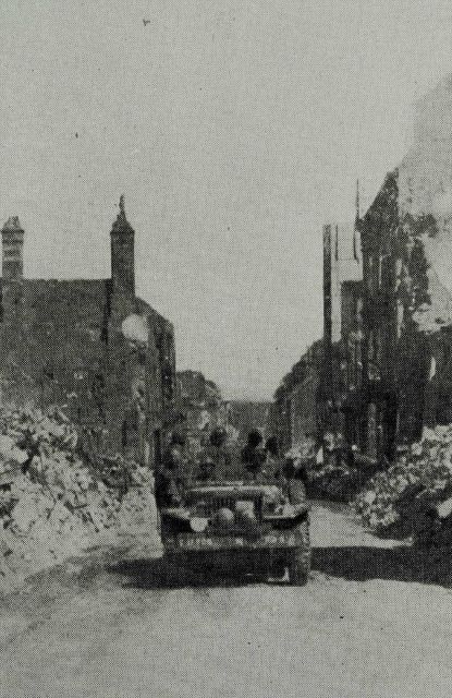 Survey party entering Vire, France, shortly after D-Day Picture
