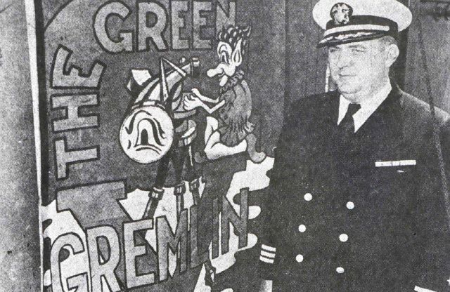 Captain Myron Graybill next to OCEANOGRAPHER banner Picture