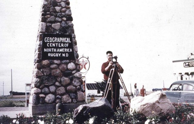 Bob Pryce operating theodolite at Geographical Center of North America Picture