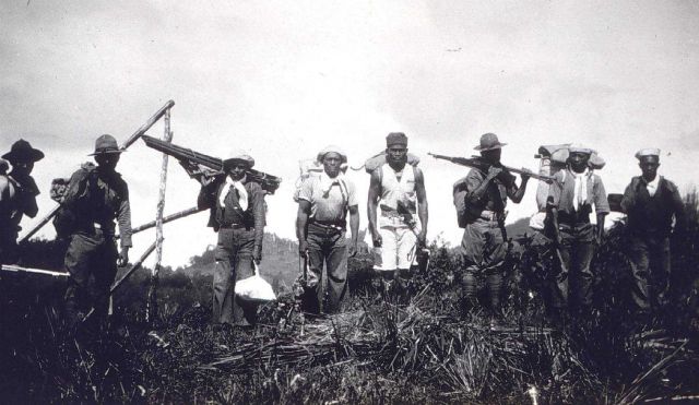 Triangulation party off the MARINDUQUE packing into the mountains. Picture