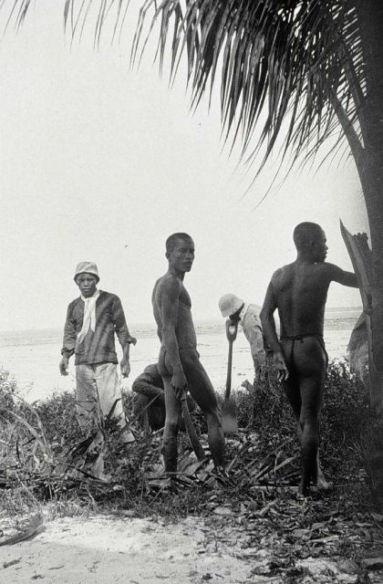 Building a signal with the help of Tagabuanas tribesmen. Picture