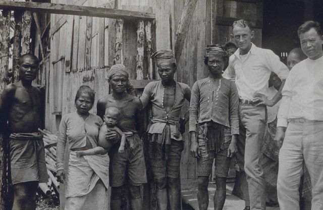 Rosenberg ashore with natives and Chinese merchant. Picture
