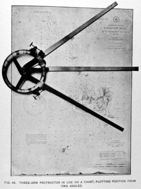 Three-arm protractor in use on a chart, plotting position from two angles Picture