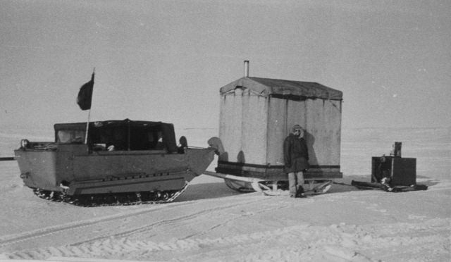 Marvin Paulson's traveling home with two Eskimos doing triangulation reconnaissance work. Picture