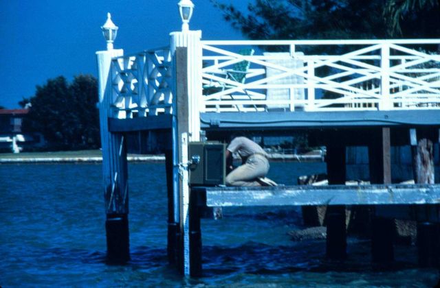 Checking tide gauge. Picture