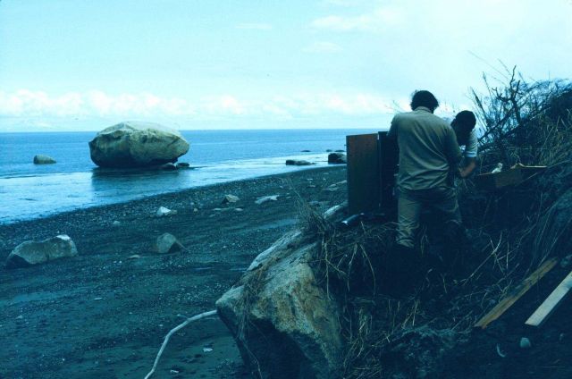 Chief Survey Technician Earl Krick of the NOAA Ship FAIRWEATHER installing a tide gauge in upper Cook Inlet. Picture