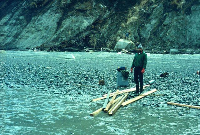 Deck hand off NOAA Ship FAIRWEATHER assisting in building of tide gauge station in Upper Cook Inlet. Picture