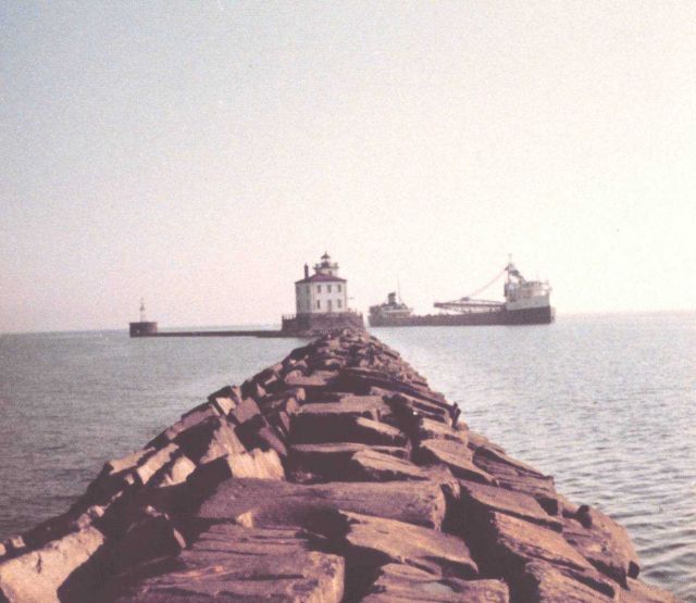 Fairport Harbor breakwater with Great Lakes ore carrier entering the harbor. Picture