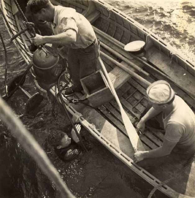 Hard hat diver cutting cable from propeller of Coast and Geodetic Survey Ship LYDONIA. Picture