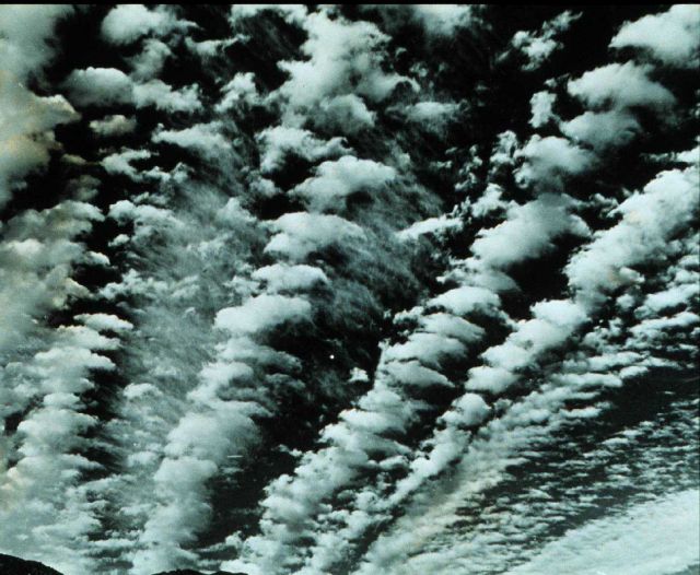 Altocumulus - bands of altocumulus clouds with cirrus filaments in the center Picture