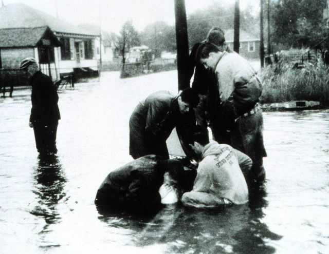 Rescuers administer mouth-to-mouth resuscitation to flood victim Hurricane Donna sent ten-foot tides through three of New York's boroughs Even the lar Picture