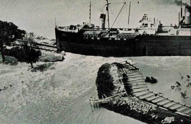 The Great Mississippi River Flood of 1927 A crevasse in the levee at Junior, Louisiana, on April 23, 1927 Caused by an out-of-control steamship striki Picture