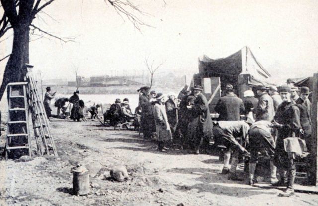 A typical scene at one of the relief stations following the flood Picture
