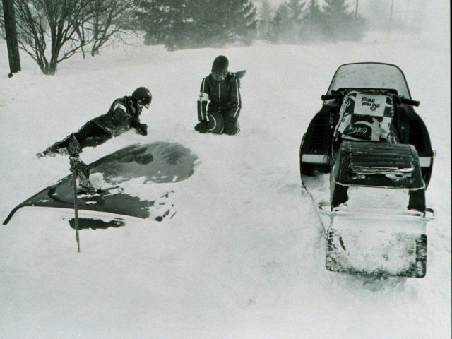 Red Cross workers search for victims buried in cars following snowfall during the Blizzard of 