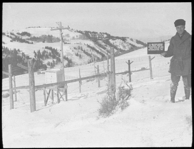 Weather Bureau observer holding sign identifying the meteorological station at the Weather Bureau/Forest Service site outside of Ephriam, Utah Picture