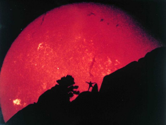 A signature image for SEC, taken from the Boulder Observatory telescope of an enterprising SEC staffer and the Sun setting behind the Flatirons mounta Picture