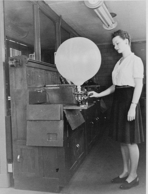 Inflating a pilot balloon Women's first opportunities in meteorology occurred as a result of WWII Picture